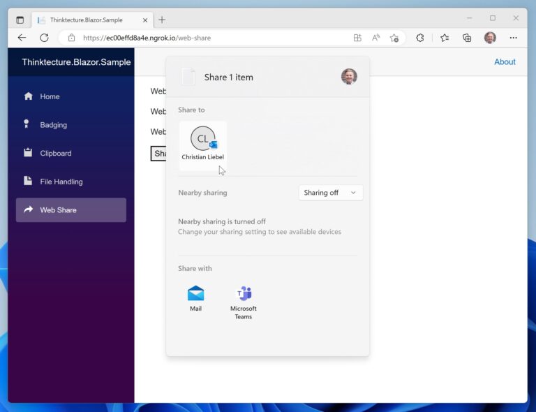 The image shows the platform-specific share dialog on top of a Blazor WebAssembly application.